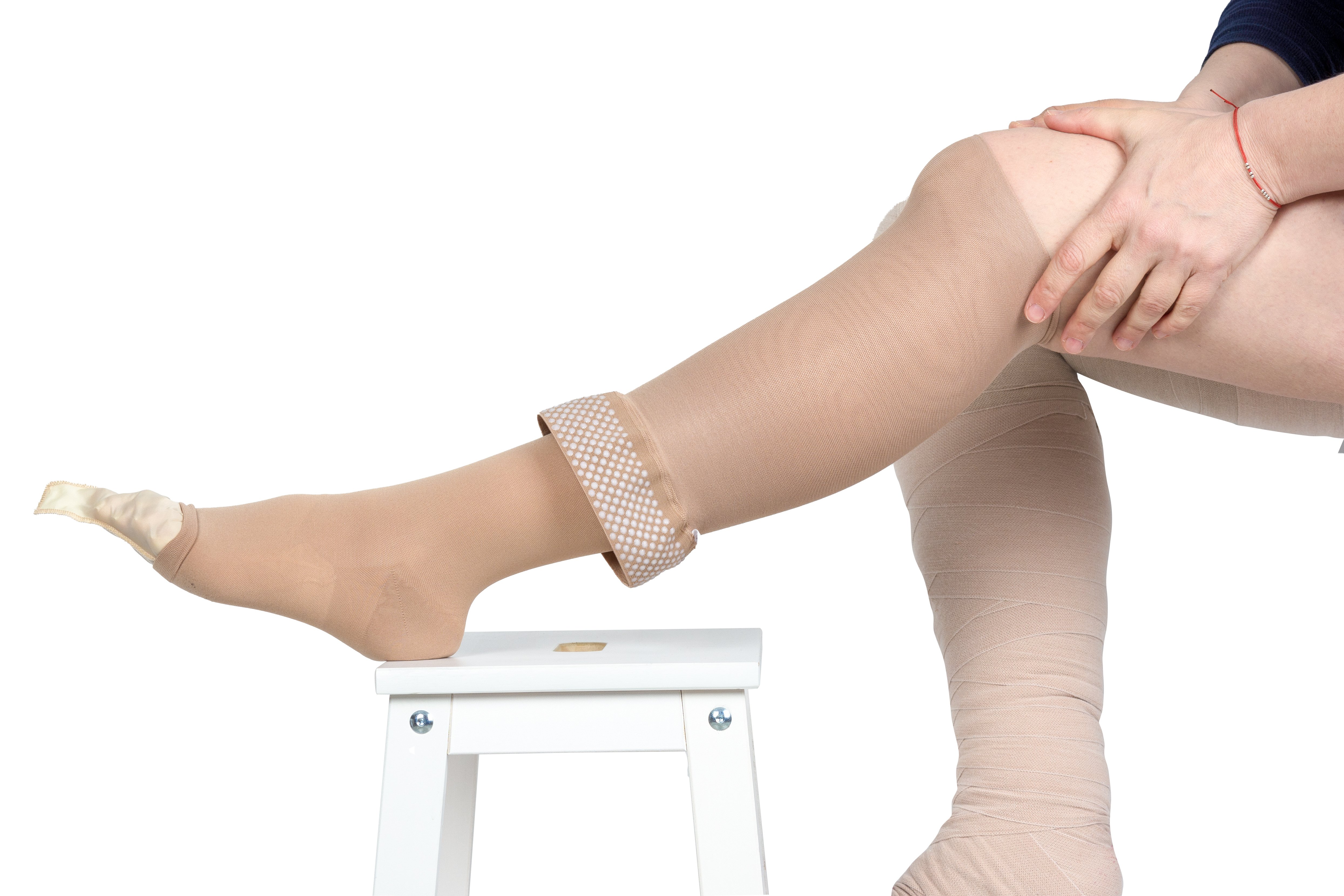 An image of a leg wrapped in a compression sock which is a Lipedema treatment.