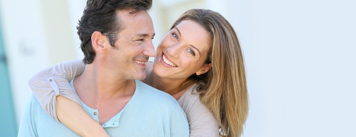 aging couple smiling youthfully