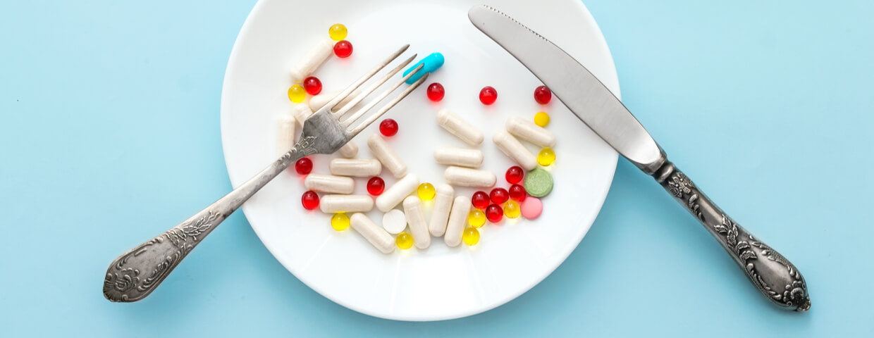 suppressants on a plate with fork and knife