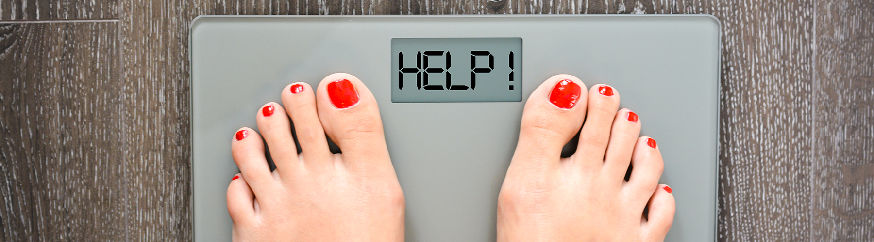 female feet on scale with HELP