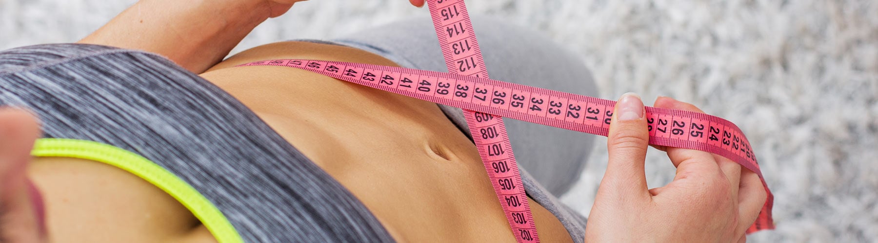 Woman measuring waist