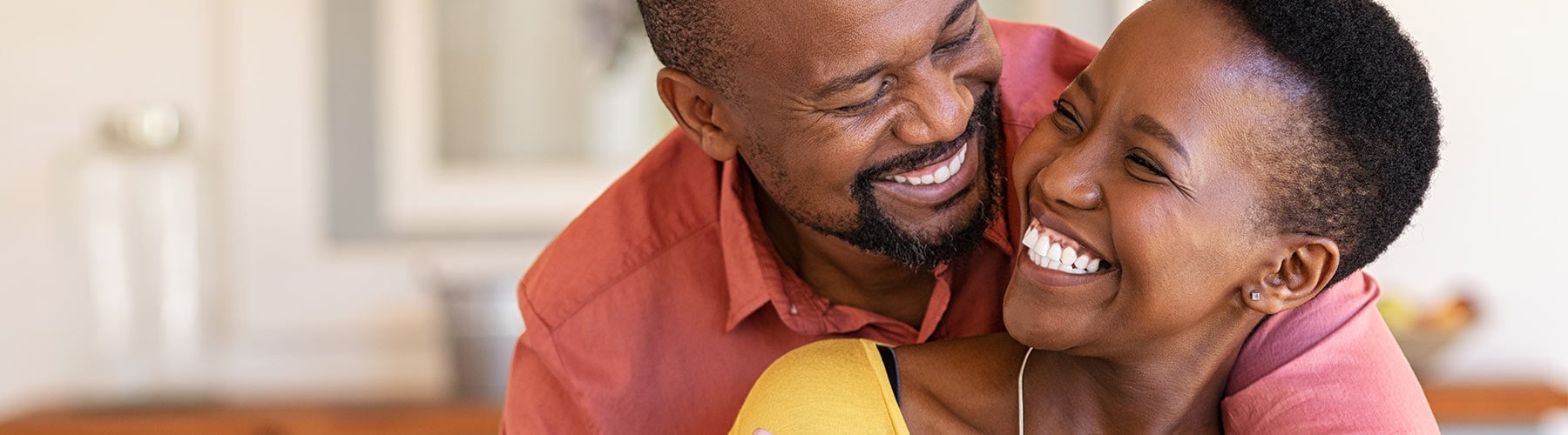 happy smiling couple embracing each other