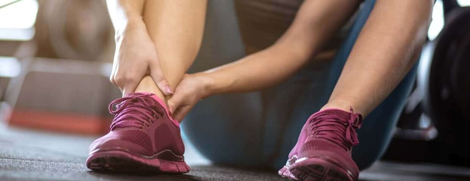 massaging leg as they recover from an injury