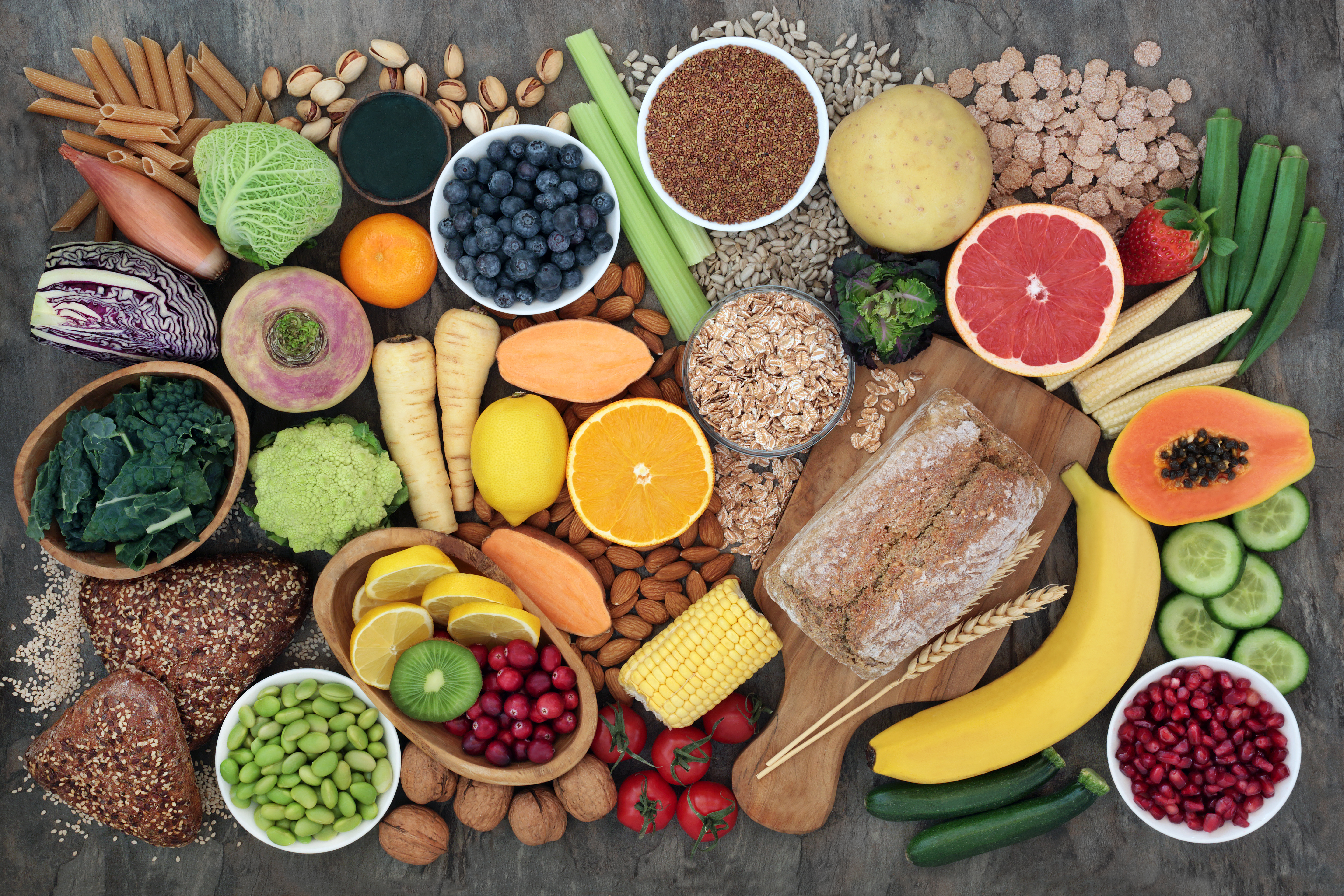 An image of raw foods around a sign that says clean eating, which is a cornerstone of the Gwyneth Paltrow Diet.)